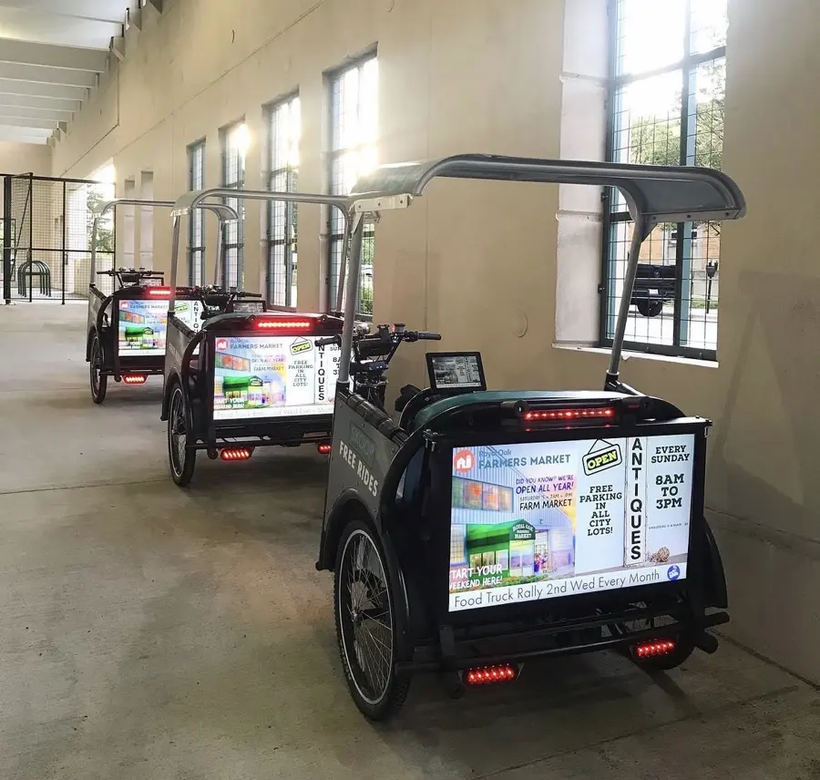 Skoop pedicab fleet running ads indoors